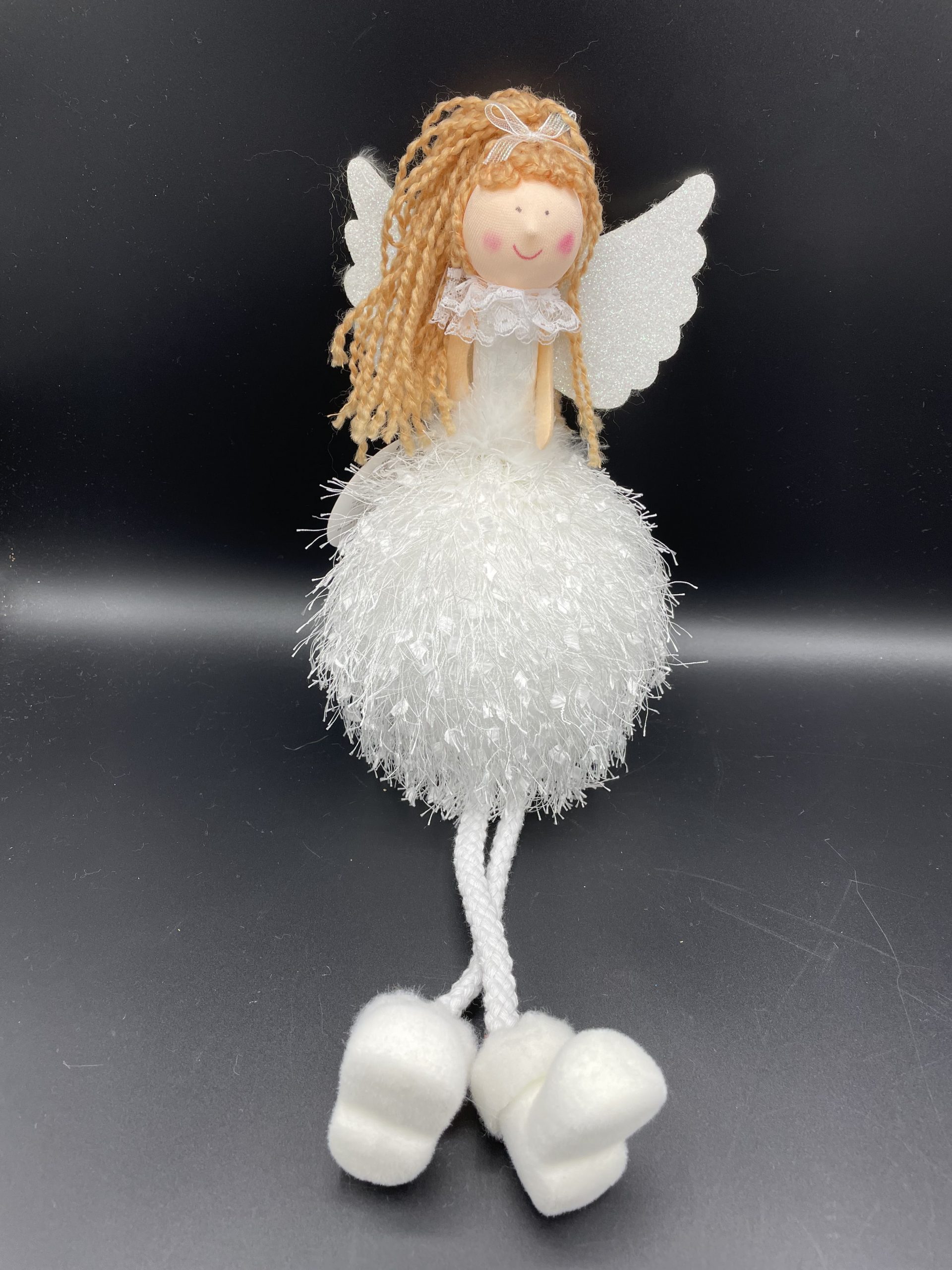 Bambolina bianca con gambe